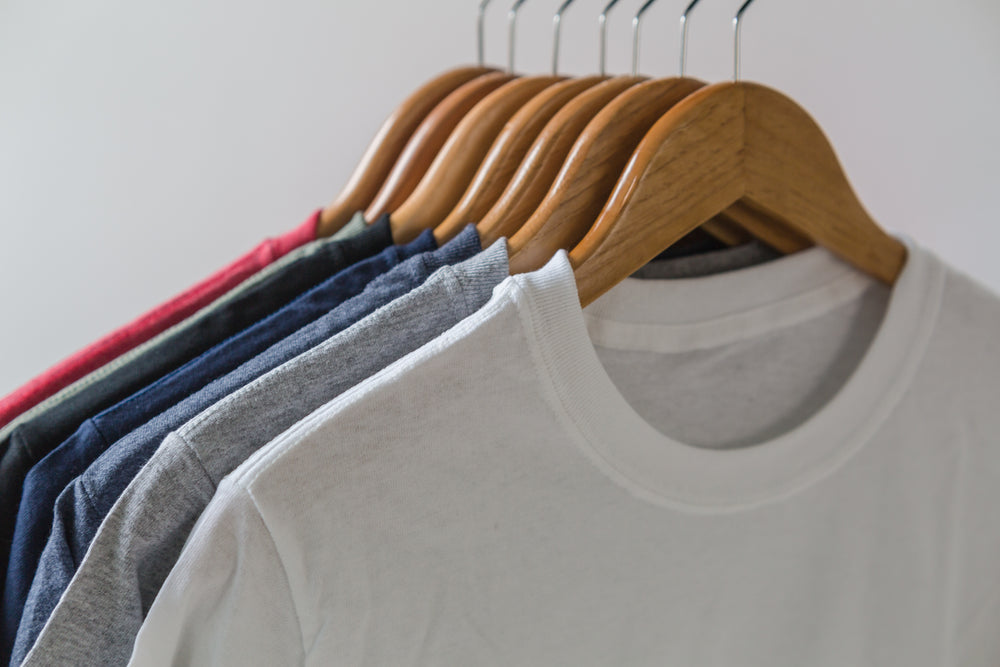 Premium Photo  Close up of colorful t-shirts on hangers, apparel background