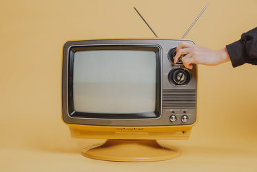 tuning a vintage television set