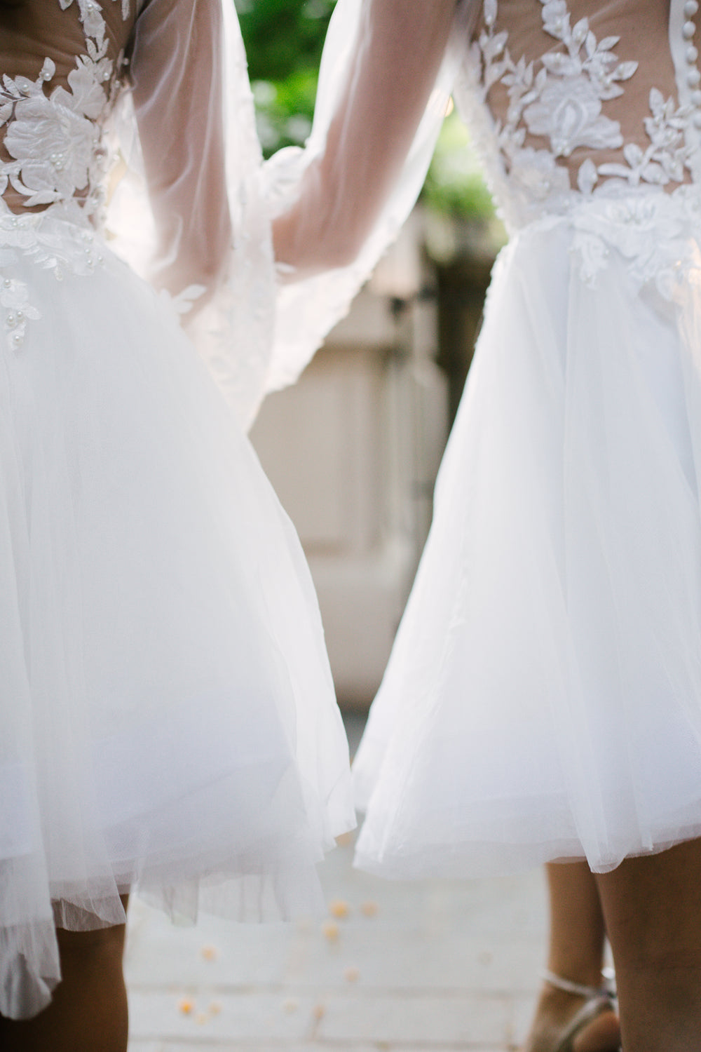 two bridesmaids walking down the aisle