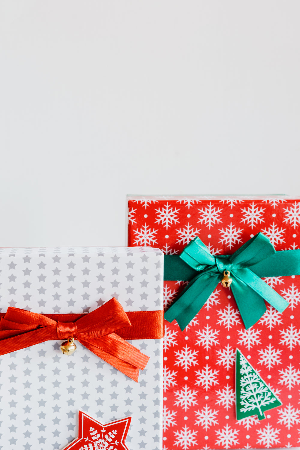 two colorful wrapped festive gifts
