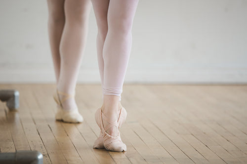 two dancers on their toes