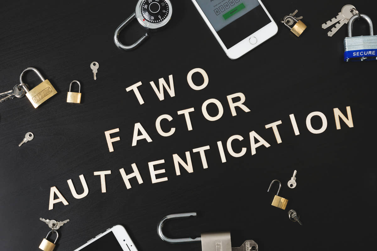 The words two factor authentication beside padlocks and keys