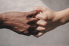 two hands interlocking fingers