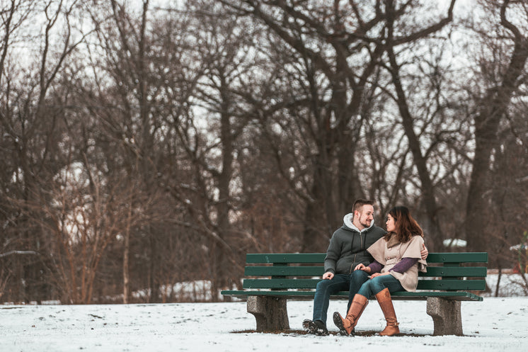 two-lovers-smile-on-a-bench-in-the-woods.jpg?width=746&format=pjpg&exif=0&iptc=0