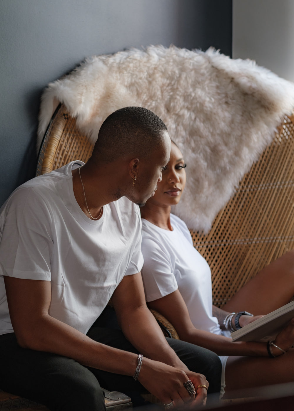 two people in white shirts look at each other