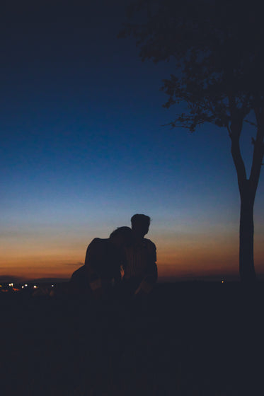 two people watching the sun go down