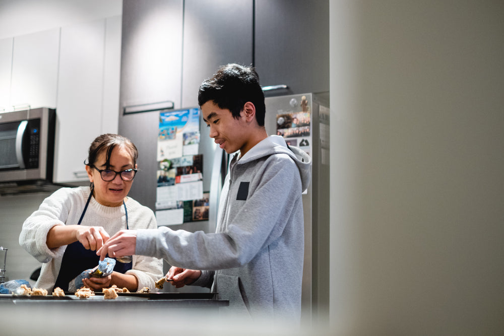 two people work together to making cookie