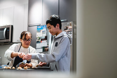 two people work together to making cookie