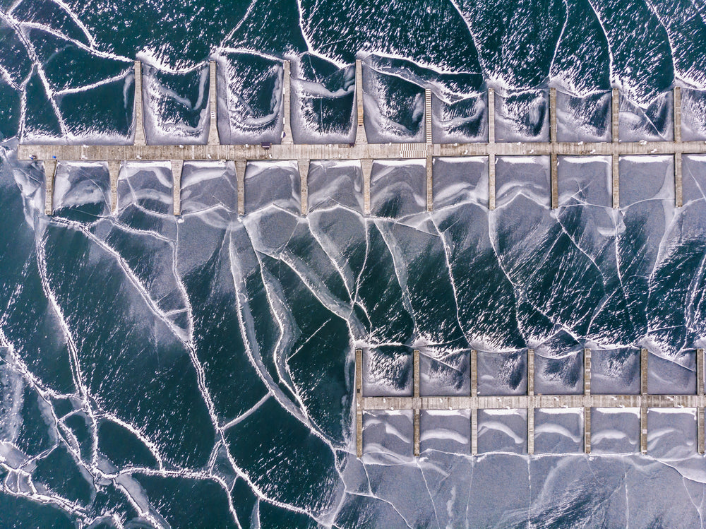 two piers on frozen sea