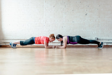 two women planking together