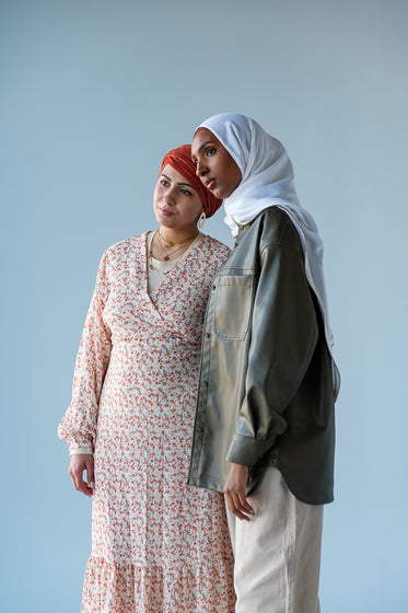 two women pose