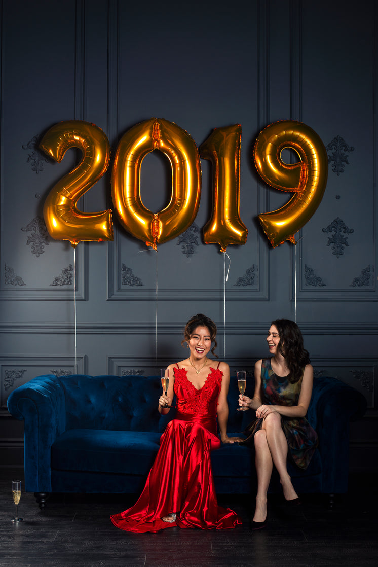 Two Women Toast To 2019 With Champagne