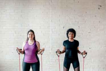 two women with resistance bands