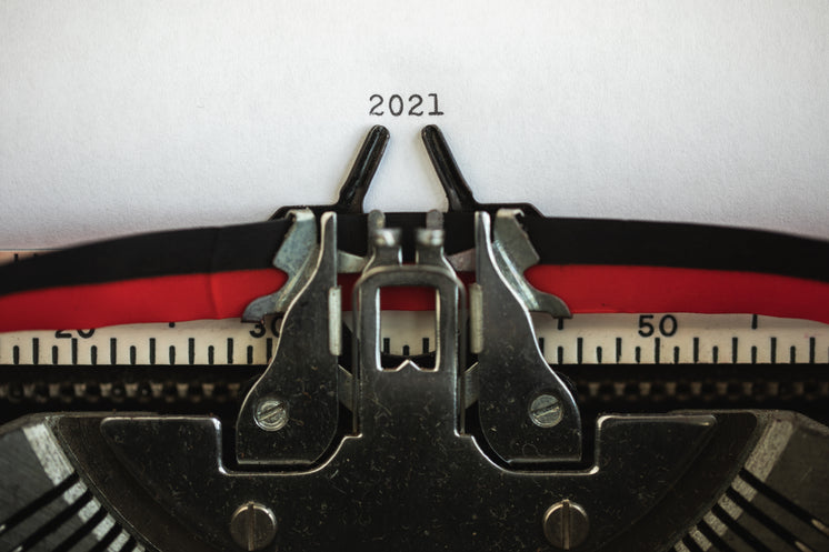 Typewriter Holds Papers With The Numbers 2021