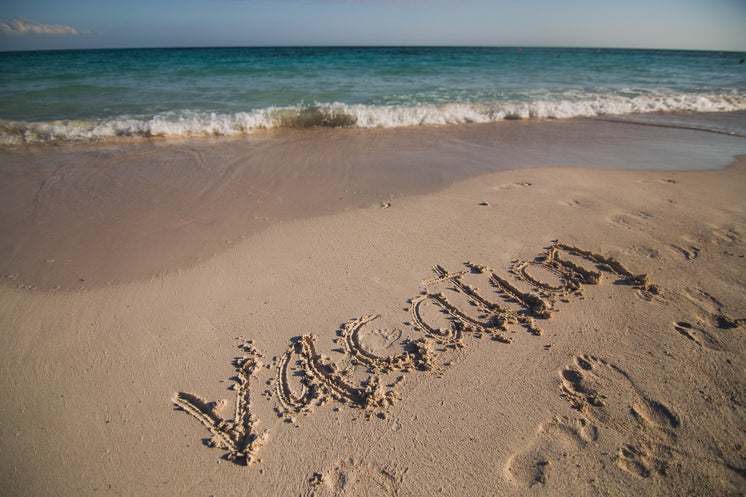 Vacation Written On Beach