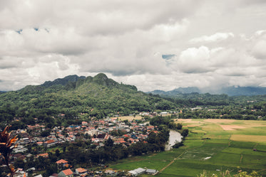 valley of rice farms surrounded by lush mountains