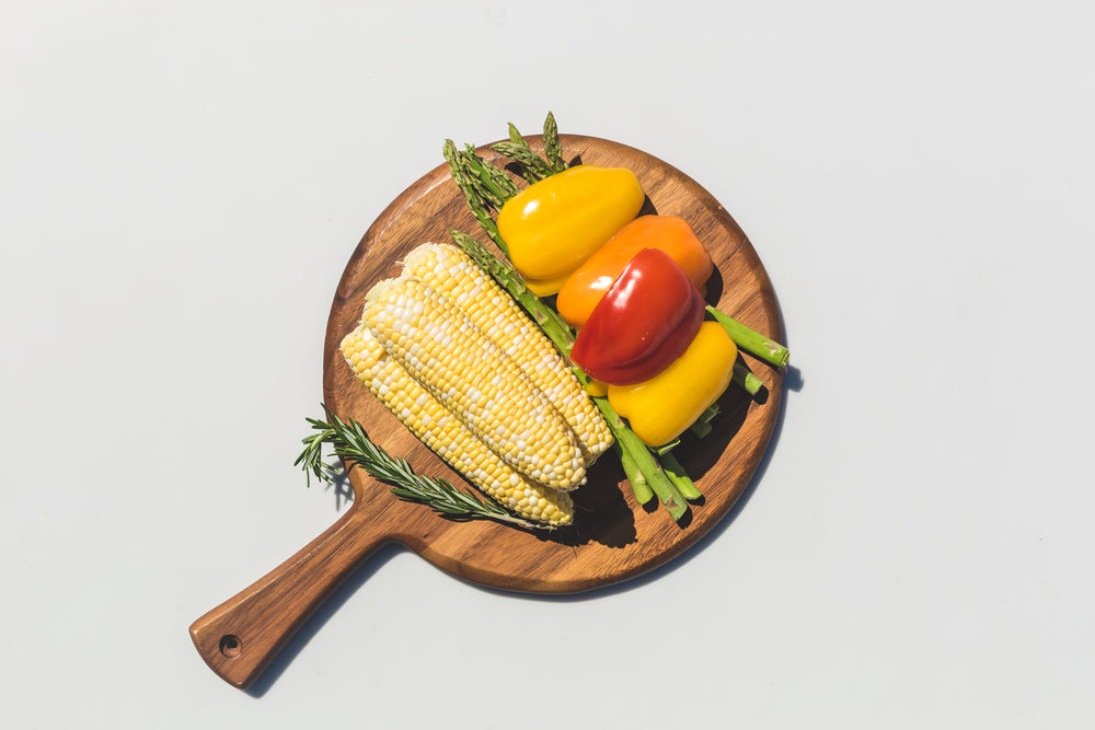 veggies on a wooden cutting board ready to be grilled