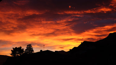 vibrant red sunset over rooftop