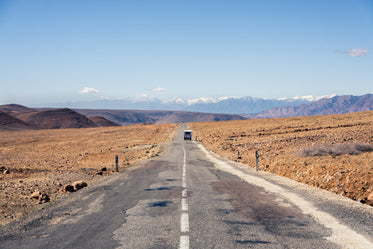 view down the white line of an empty paved road