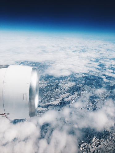 view from airplane window over snowy continents