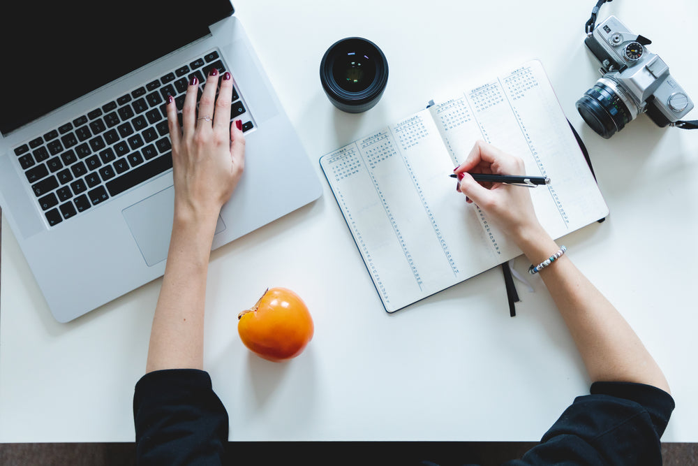 view of a person working at their desk from above