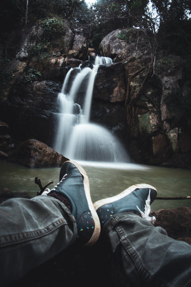 view of a waterfall from the lap of the photographer