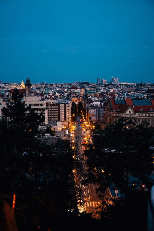 view of city lights at twilight as sun sets