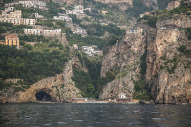 view of mountain homes above water