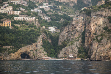 view of mountain homes above water