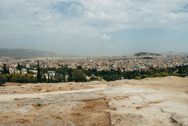 view of the city from a rocky hilltop