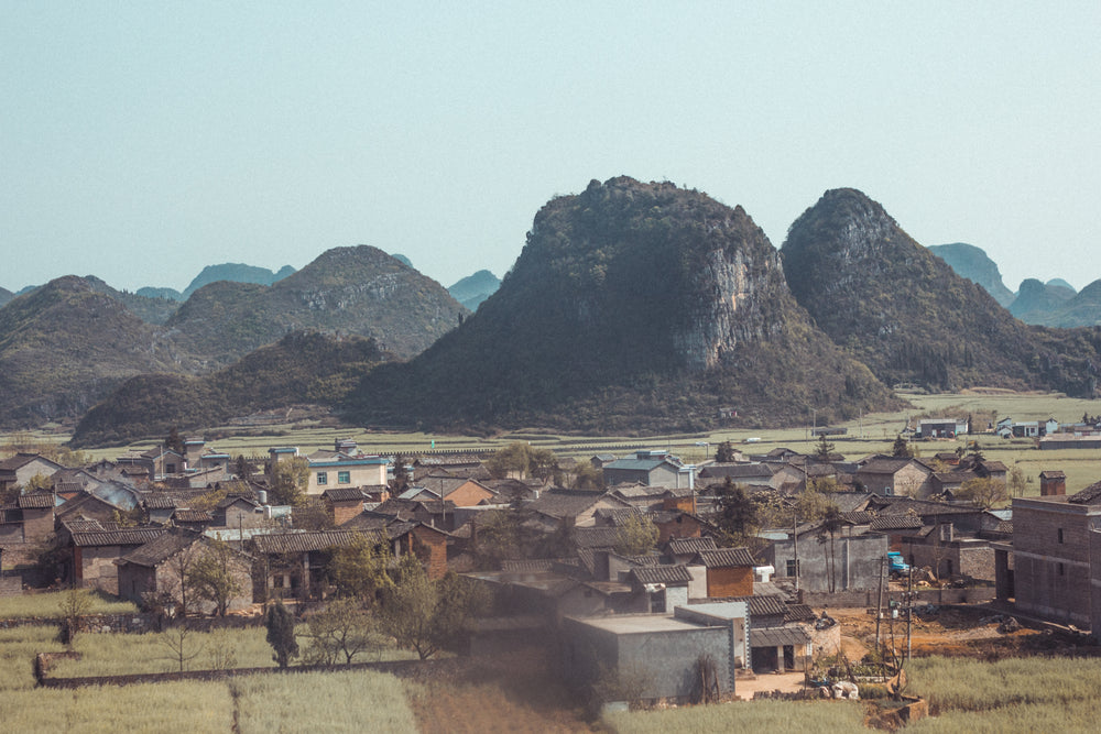 view of village below mountains