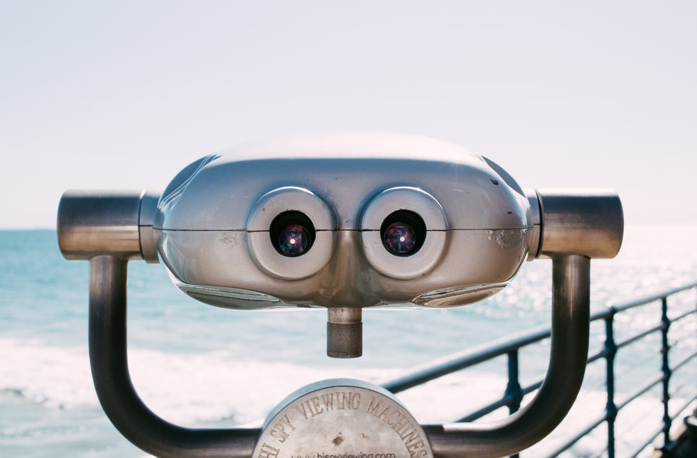 viewing machine stood on a boardwalk