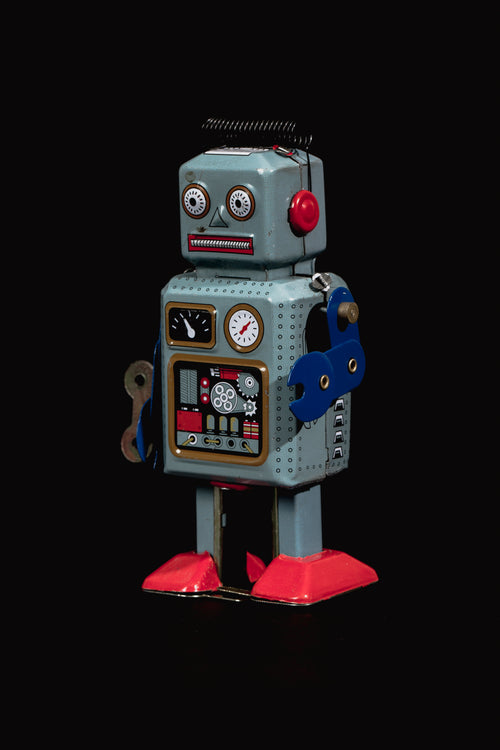 vintage blue robot portrait in front of black background