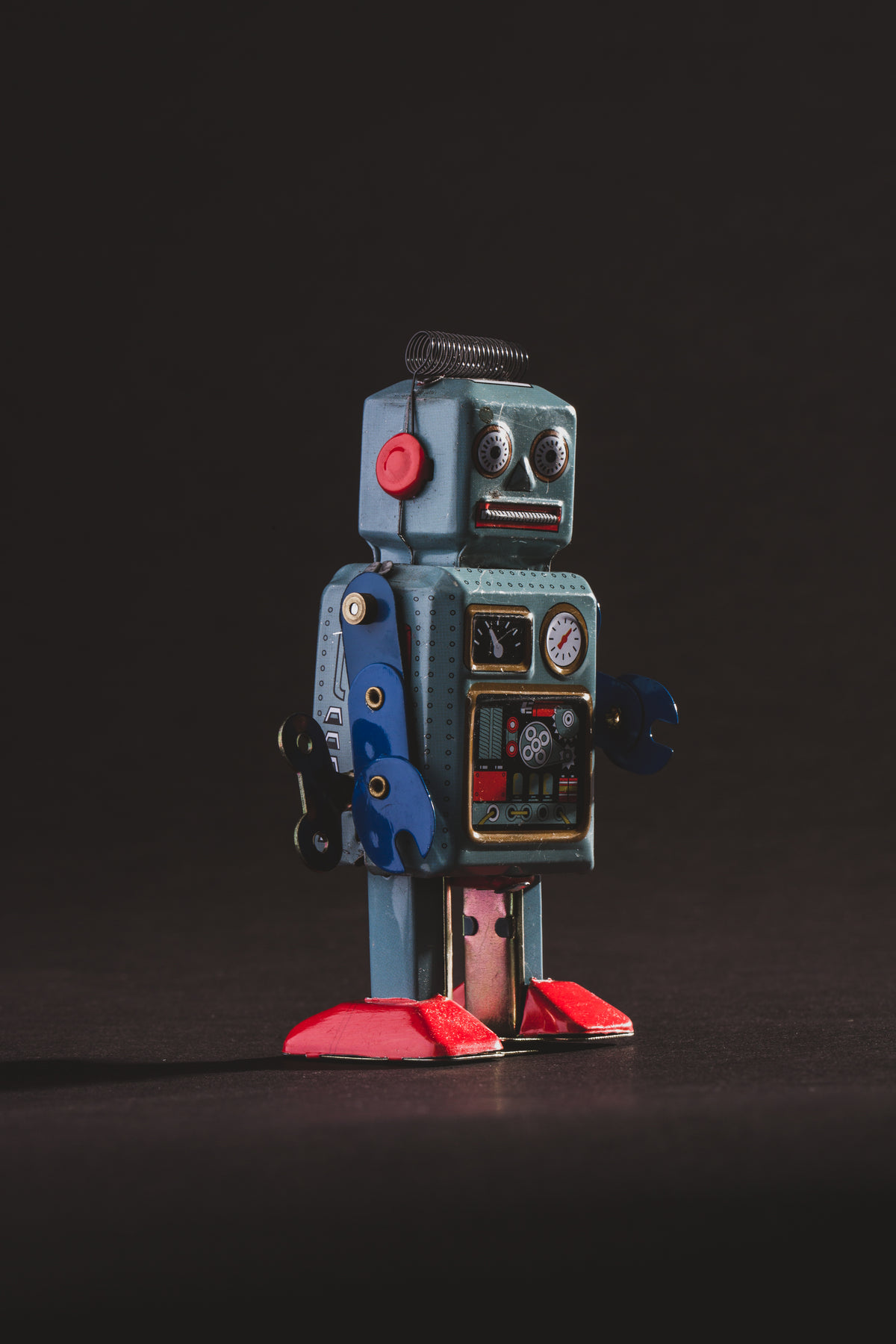 vintage blue robot portrait in the dark