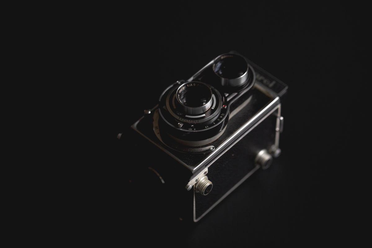 vintage camera against black