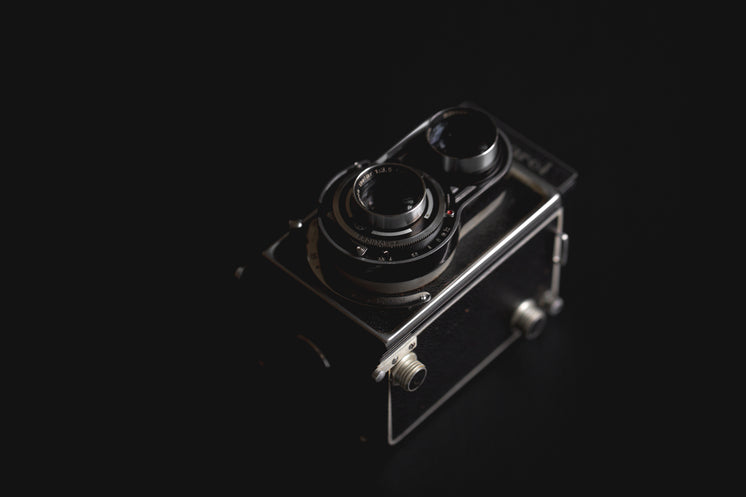 Vintage Camera Against Black
