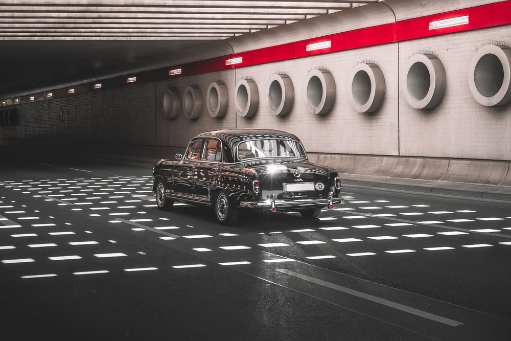 vintage car driving through stunning underpass