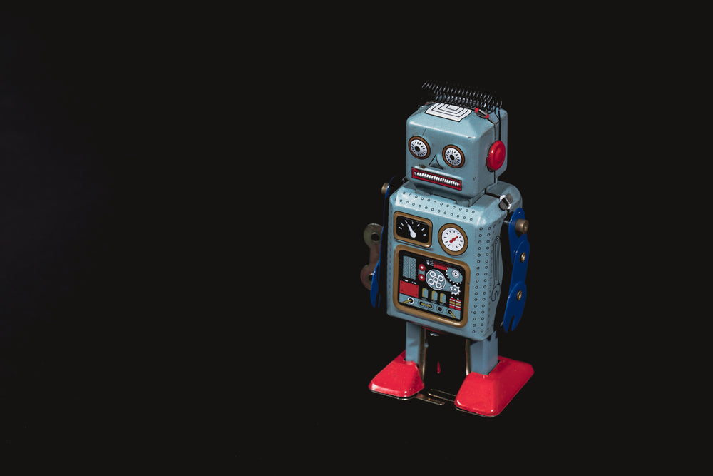 vintage robot with lots of black negative space