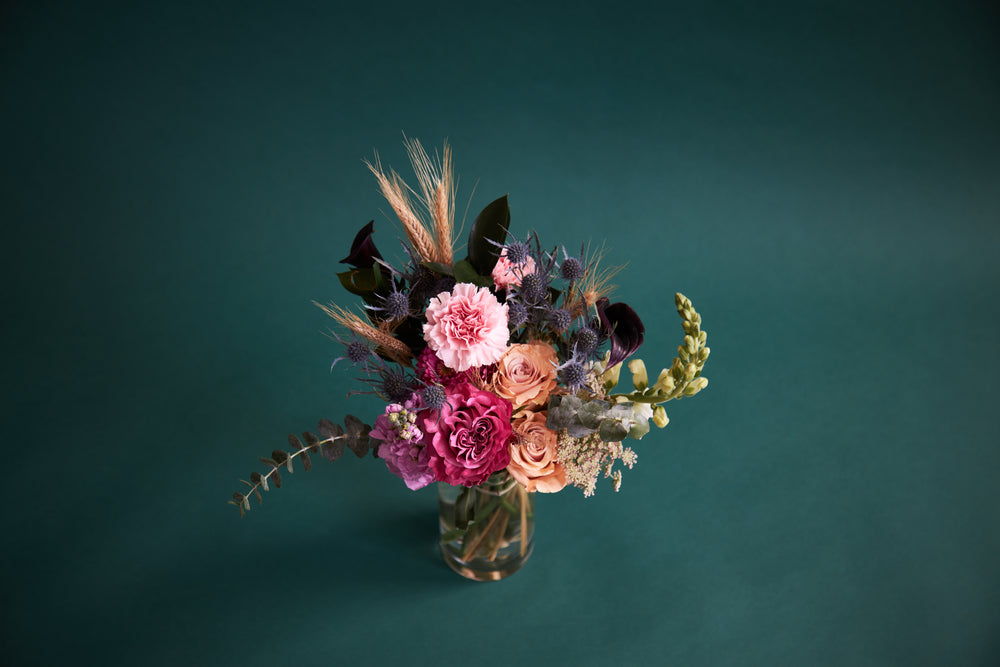 vivid floral arrangement on dark teal