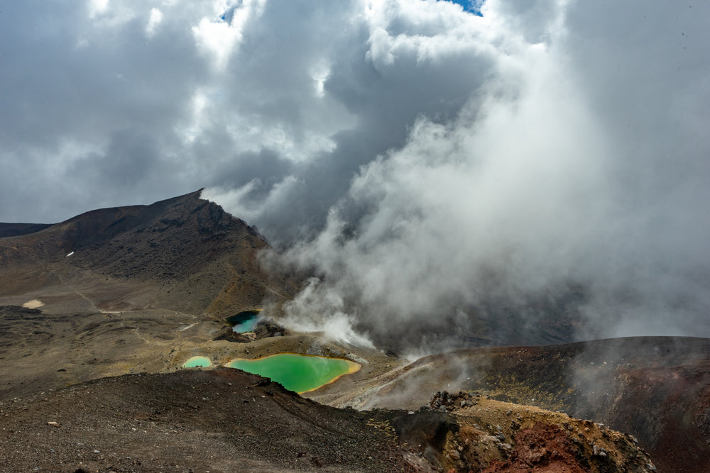 volcanic hills and green pools