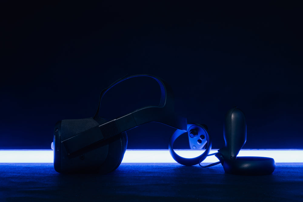 vr headset and controllers backlit by blue light