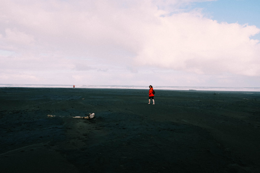 walk on a black sand beach