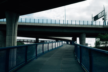 walkway under large concrete overpass