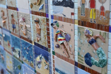 wall made of sculpted mosaic tiles