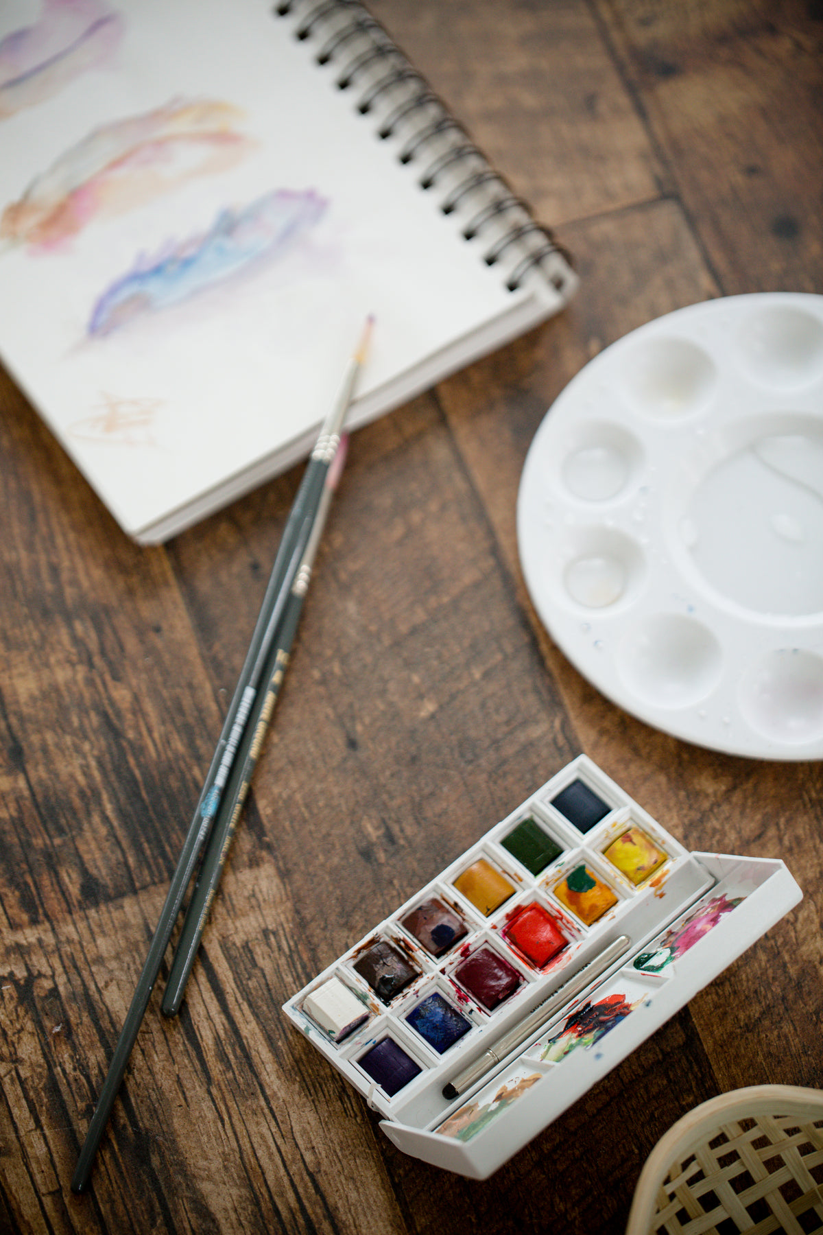 water color supplies on a wooden table