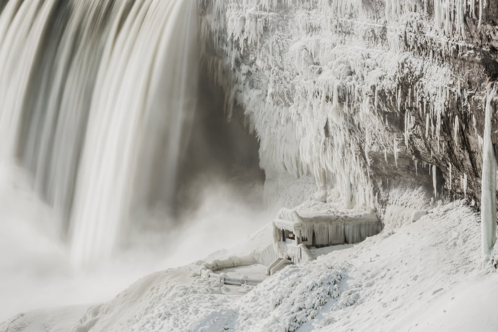 water falls over icey rockface