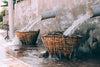 water flowing over wicker baskets