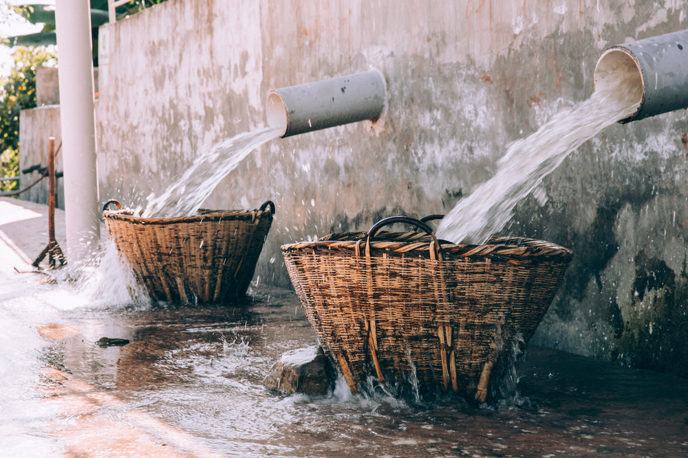 water flowing over wicker baskets