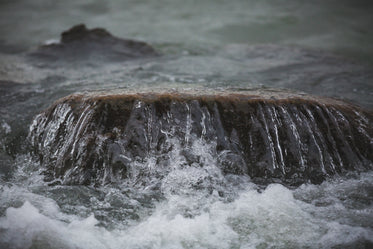 water washes over stone