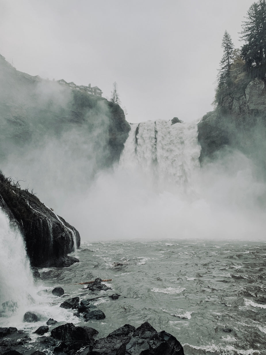 Browse Free HD Images of Waterfall Creating Mist Over The Shore